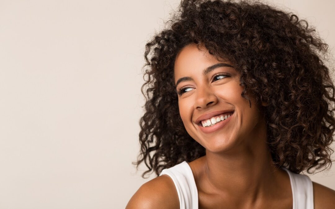 Beauty portrait of black woman on light background