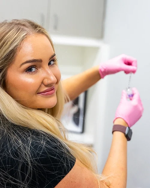 mystique provider filling botox syringe