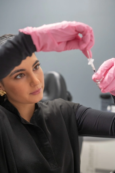 Aesthetician measuring BOTOX at Mystique MedSpa