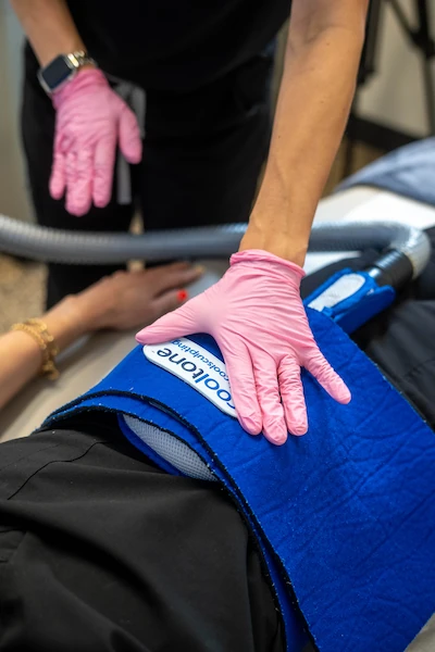 Patient receiving Cooltone at Mystique MedSpa
