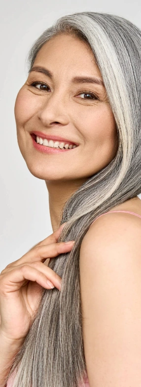 mature woman touching long healthy hair
